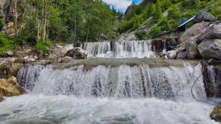 Beautiful mountain waterfalls as seen from a drone, alpin landscapeのeditorial素材