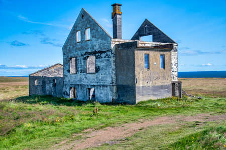 Abandoned construction in the countryside near the ocean. Loneliness concept.の写真素材