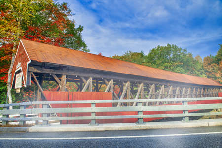 Bartlett wooden covered bridge in New England during foliage season, USA.の写真素材