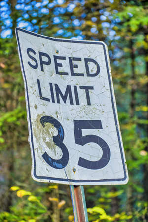 Speed Limit 35 Miles per Hour street sign in the woods.の写真素材