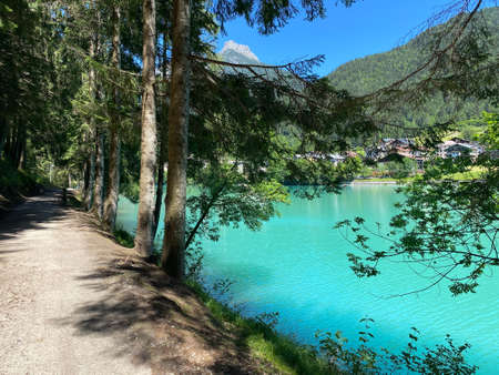Beautiful mountain lake with blue color and surrounding trees.の写真素材