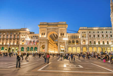 MILAN, ITALY - SEPTEMBER 2015: Tourists and locals enjoy night life in Duomo Square, city tourist centerのeditorial素材