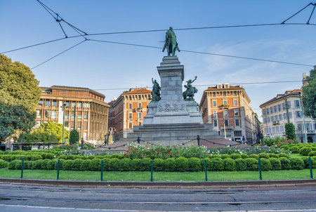 MILAN, ITALY - SEPTEMBER 2015: Tourists on square Largo Cairoli near Monument to Giuseppe Garibaldi...