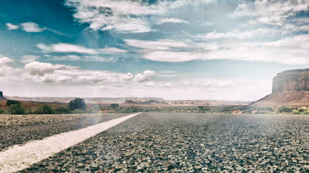 Countryside road through the fabulous Monument Valley in summser season, aerial view from drone.の写真素材