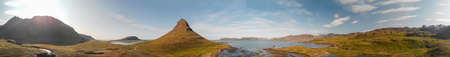 Sunset sky colors over Kirkjufell Mountain, panoramic aerial view.の写真素材