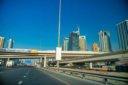 DUBAI, UAE - DECEMBER 5, 2016: Sheikh Zayed road traffic on a beautiful sunny day.のeditorial素材