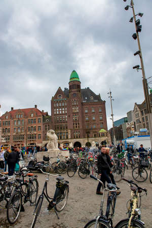 AMSTERDAM, THE NETHERLANDS - APRIL 25, 2015: Tourists and locals walk along the city streets.のeditorial素材