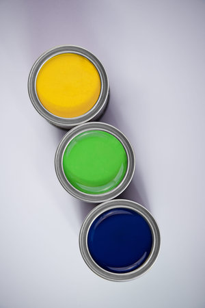 Canisters with colorful paints isolated on white backgroundの写真素材