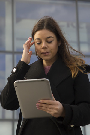 Young business woman with a tabletの写真素材