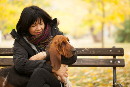 The woman with a dog in the park, Selective focus and small depth of field, lens flare