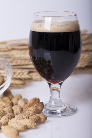 Black beer in the glass on the table, Selective focus and small depth of fieldの写真素材
