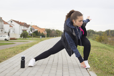 Young woman exercise prior to running, Selective focus and small depth of field, lens flareの写真素材