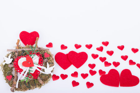 Gift for Valentines day and red hearts on a white backgroundの写真素材