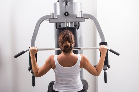 Young woman exercises in a gym, Selective focus and small depth of field