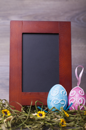 Easter decoration with eggs on a wooden backgroundの写真素材