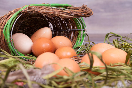 Fresh organic eggs cooking on a wooden background.