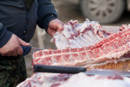 Closeup cut the middle part of the pork carcass knife