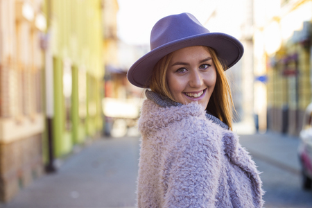 Portrait of a beautiful young modern and urban woman with hat outdoorの写真素材