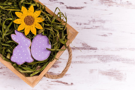 Easter gingerbread cookies on wooden table. Rabbit and egg. Greeting card. View from above.Copy...