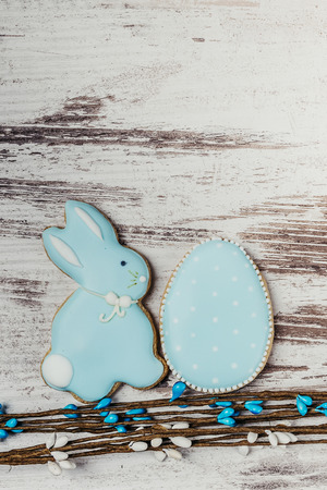 Easter gingerbread cookies on wooden table. Rabbit and egg. Greeting card. View from above.Copy space.の写真素材
