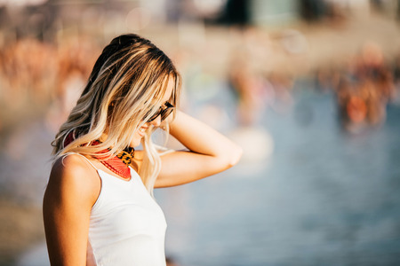 Fashion Lifestyle, Beautiful young woman in the sunglasses on the beach at the day time. Travel and Vacation.の写真素材