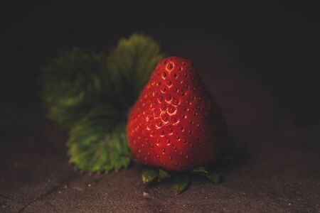 Red strawberry isolated on black background with copy spaceの写真素材
