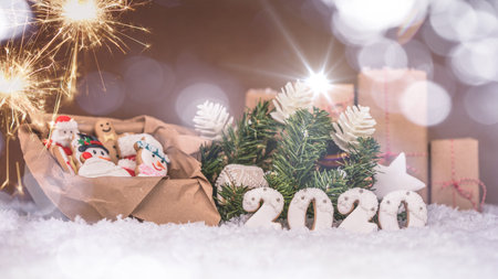Christmas gingerbread in a box, holiday gift and christmas decorations on wooden background with...