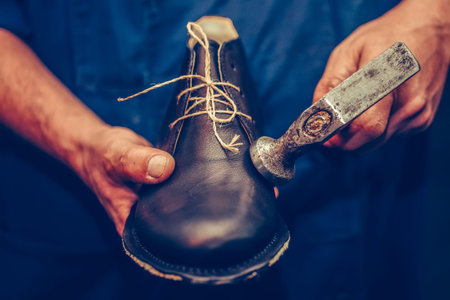 Shoemaker workshop for making shows artisan handmade manufacturing leather shoes. Shoe manufacture business for traditional vintage shoe, making, craft shoes in traditional style. Selective focusの写真素材