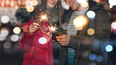 Young happy couple is hugging and laughing. Young man and his girlfriend are having fun with...