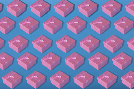 Minimal composition background of pastel pink Christmas gift box.  Holiday, gift, shopping, sale, wedding and birthday concept.の写真素材