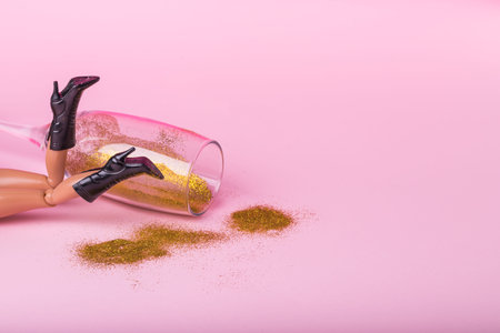 Minimal  trendy composition made of  female doll laying on the floor with trendy high heel boots and...