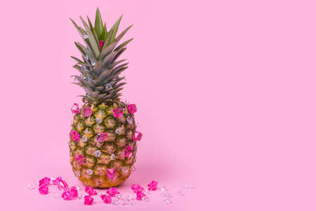 Glamorous female pineapple hipster with bright diamonds, stylish fruit. Minimal concept, modern creative art. Fashion and trend. Copy spaceの写真素材