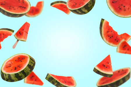 Ripe watermelon cut into pieces flying in the air. Floating, flying, levitating sliced fresh...