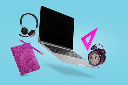 Creative minimal composition of back to school made with a laptop, headphones, school supplies and...