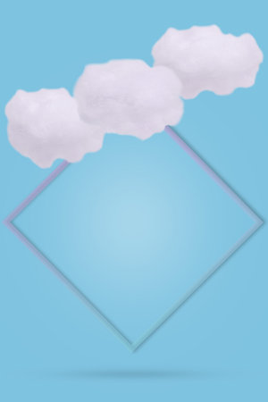 Soft clean cotton clouds with frame on a blue background. Creative minimal design composition with...