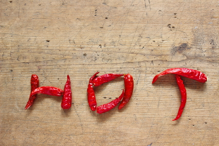 dry hot chilli on wood backgroundの写真素材