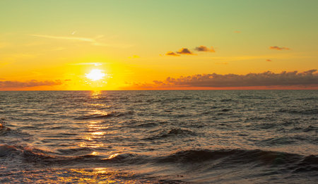 Beautiful sunset on the Baltic Sea, multi-colored colors, romantic mood, golden light reflections on the water,の写真素材