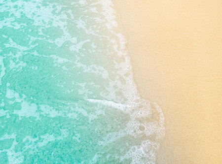 Wave bay beach with blue soft water, beautiful sandy beach and soft blue sea waves,blue sea water with brown sandy beach, Soft blue sea waves on a clean sandy becahの写真素材
