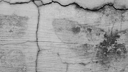 gray cement wall background texture with cracked patternの写真素材