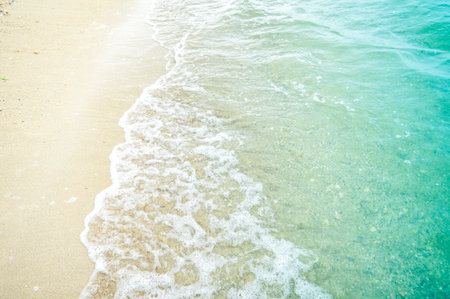 Peaceful blue green sea waves shore. Ocean coast view. photo beachfront. Seaside exotic tropical nature landscape .Focus on beach waveの写真素材