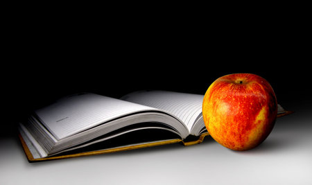 An open diary and apple, Business launch.の写真素材