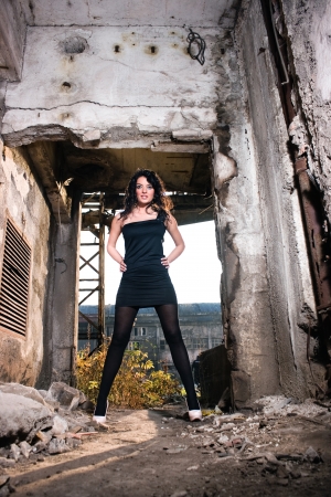 Beautiful young woman posing in a old factoryの写真素材