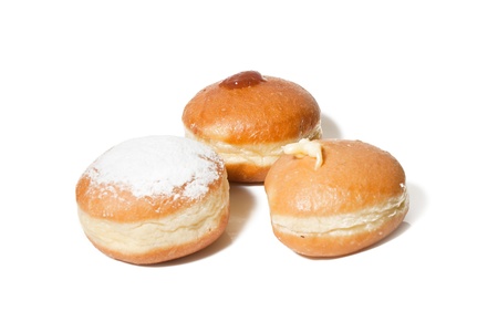 Donut with hazelnut, strawberry and vanilla cream, isolated on white backgroundの写真素材