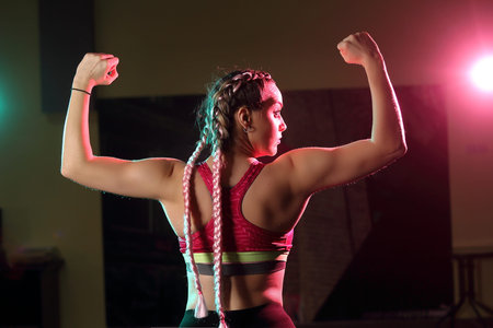 Woman in sportswear exercising in the gym