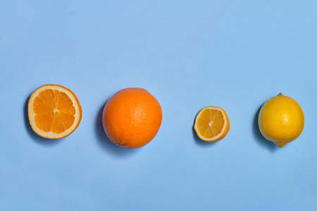 Orange and lemon commands and whole on a blue background