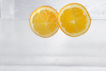 Lemon slices water splash, isolated on a white background