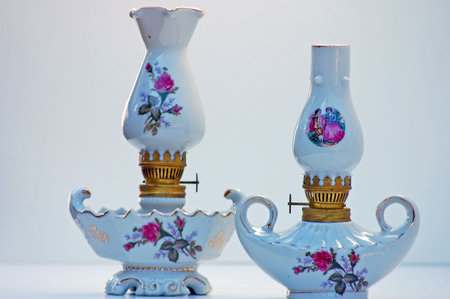 These two white floral lanterns have been in my family for many generations.  These are a macro closeup shot against a white background.の写真素材