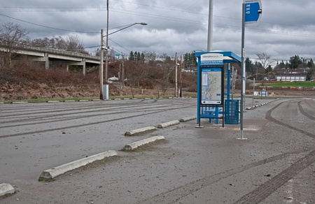 STANWOOD, WA â DECEMBER 14: - Flood waters from Stillaguamish river poured over recently and left a muddy mess at this bus stop.  The natural disaster took place December 14, 2010 in Stanwood, Wa.のeditorial素材