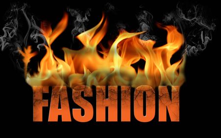 This is the word fashion on fire with flame text with smoke and steam, on a black background.の写真素材