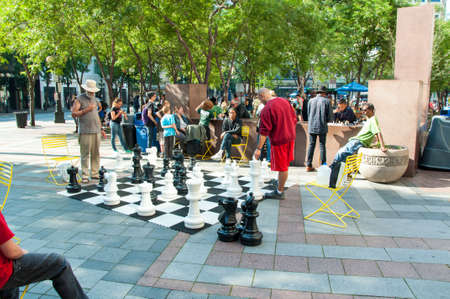 Seattle, WA USA August 23, 2014:  People enjoy the giant outdoor chess game in Occidental park in Pioneer Square in this urban city image in Seattle.のeditorial素材